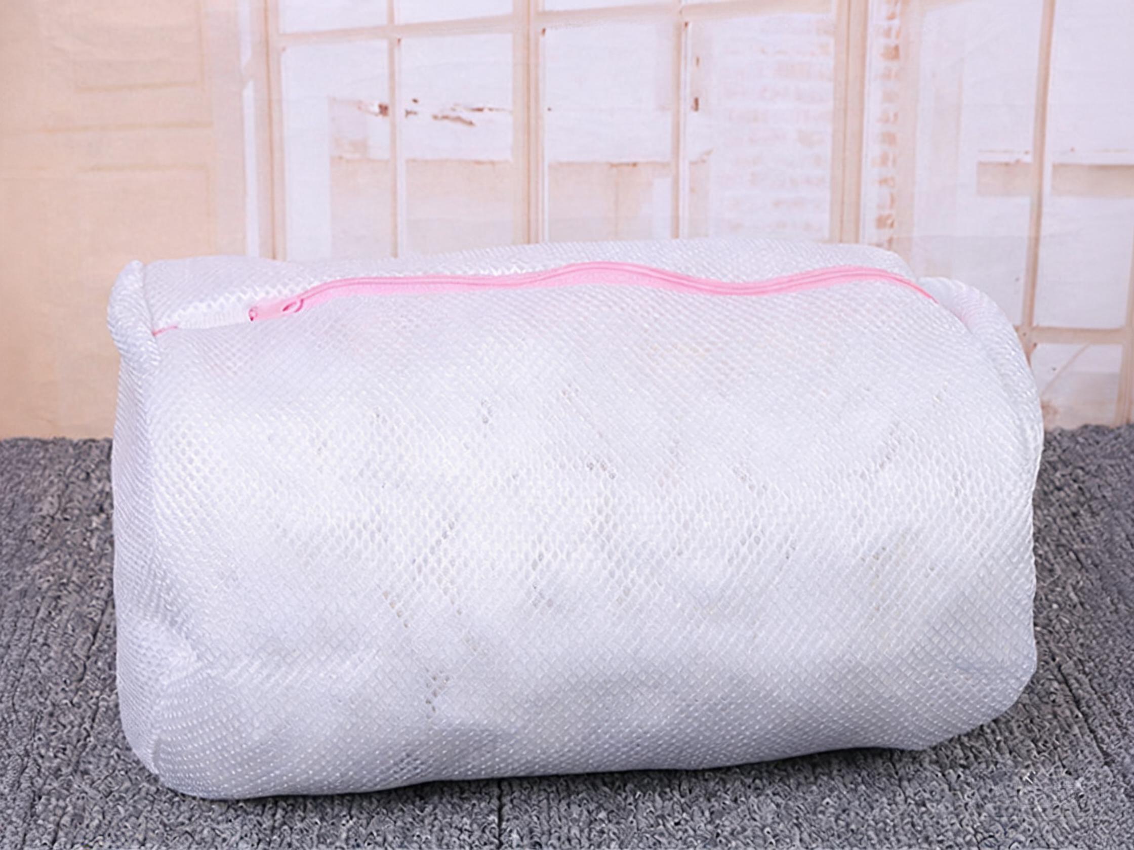 White fine mesh cylindrical wash bag with pink zipper